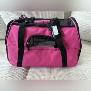 Pink small dog carrying cage.